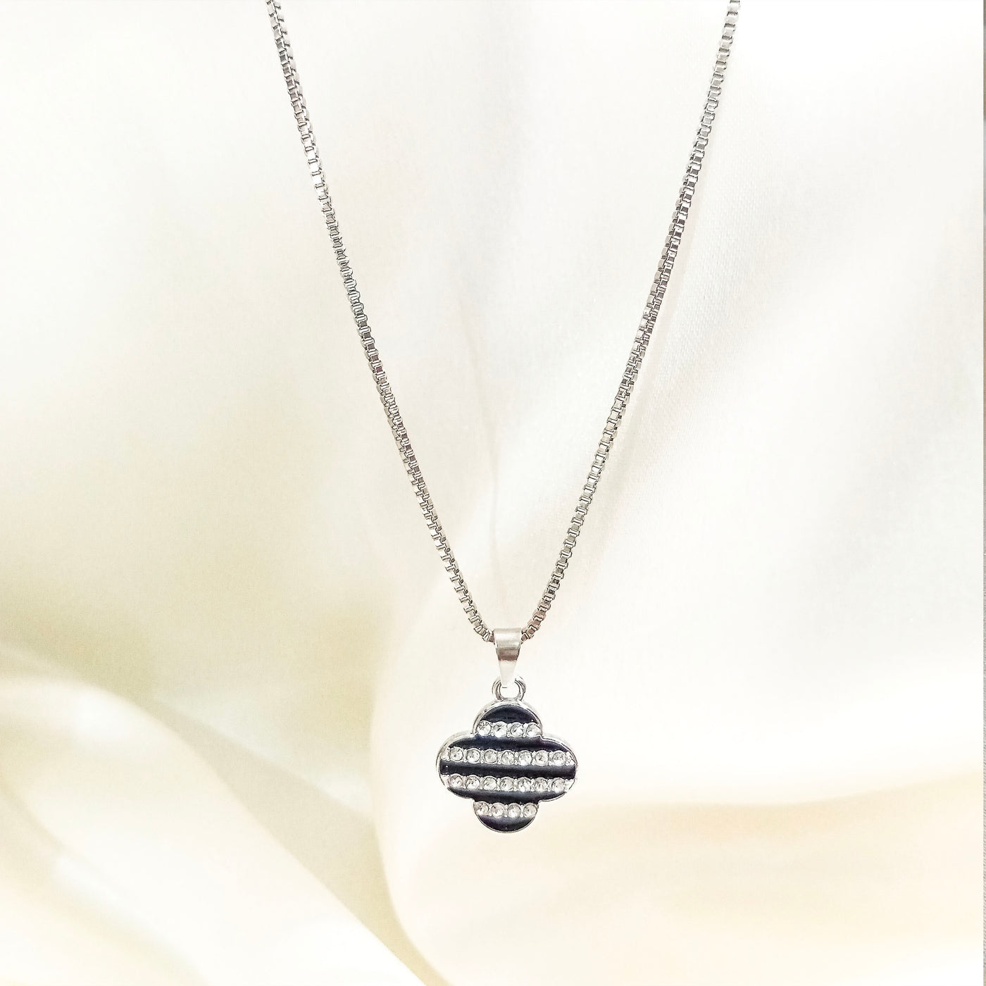 Silver Clover Pendant – Black & White Stone Detailing